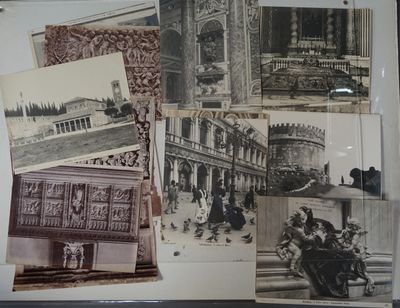 several old black and white photos of people and buildings on display