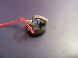 a ring that is sitting on top of a piece of jewelry