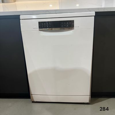 a picture of a dishwasher in the middle of a kitchen