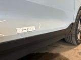 the rear end of a car with a sticker on it