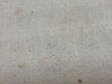 an old book sitting on top of a white table