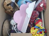 a cardboard box filled with toys and other items