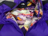 purple and black down filled jacket with a colorful print on it