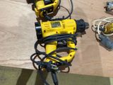 two electric tools that are sitting on a table