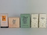 four boxes of cigarettes are lined up on a shelf