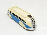 a toy bus that is sitting on a white surface