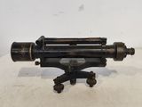 an old telescope on a tripod stand on a white surface