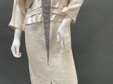 an image of a mannequin wearing a dress and jacket