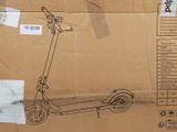 a cardboard box with a drawing of a scooter on it