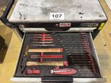 a lot of tools in a tool box on the floor
