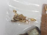 an image of a watch, a watch chain, and a watch in a plastic bag