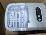 a box that has a small machine inside of it