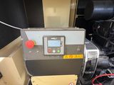 a machine that is sitting in the back of a truck