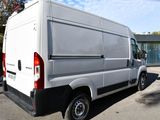 a white van that is parked in a parking lot
