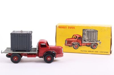 a red toy truck with a box on the back of it