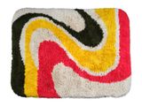 the rug is multicolored and has black, yellow, red, and white swirls