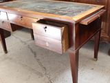a wooden desk with a marble top and two drawers