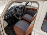 a white car with brown leather seats and a steering wheel
