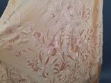 an image of a woman ' s shawl with flowers and fringes on it