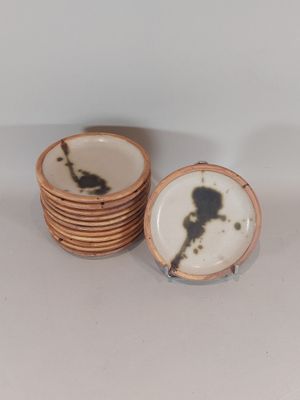 a stack of plates with a black and white picture on them