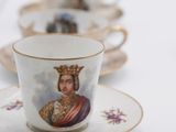 a cup and saucer with a picture of a man on it