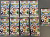 Les paquets de cartes à collectionner Pokémon sont alignés sur une table