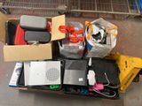 a cart full of electronics and other items on the floor