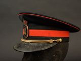 an image of a black hat with a red stripe on it