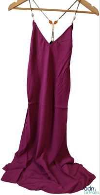 a picture of a purple dress hanging on a hanger