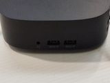 a small black device sitting on top of a white table