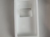a white phone that is sitting on top of a table