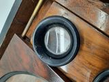a close up view of a clock on a wooden table
