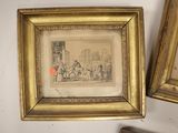 two framed pictures of a man and a woman in a living room