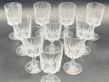 a lot of glasses that are sitting on a table