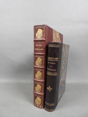 two books sitting on top of each other on a table
