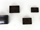 several pieces of chocolate sitting on top of a white surface