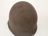 a helmet that is sitting on a white surface
