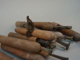 a lot of old tools that are sitting on a table