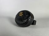 a small black bag with a gold buckle on it