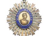une image représentant une médaille sur laquelle figure le portrait d'un homme