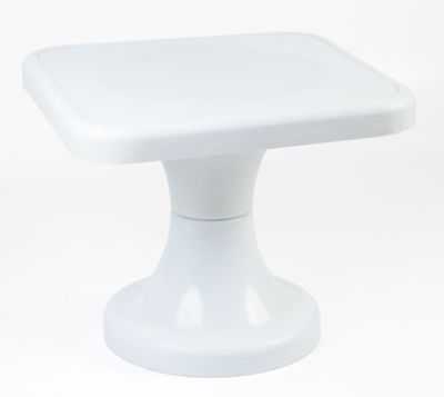 a small white table with a square top on a white background