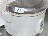 a crock pot sitting on top of a table in a kitchen