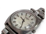 a silver wrist watch with roman numerals on it