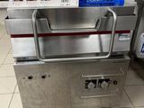a machine that is sitting on the floor in the kitchen