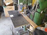 a machine that is sitting in a room with a lot of tools