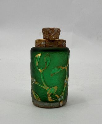 an image of a green glass bottle with a gold lid