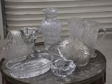 a table with a lot of glass items on top of it