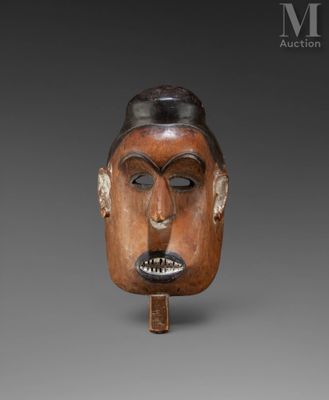 an image of a wooden mask with a face on it