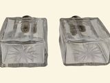 two clear glass boxes sitting next to each other