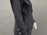 an image of a mannequin wearing a black jacket and black pants